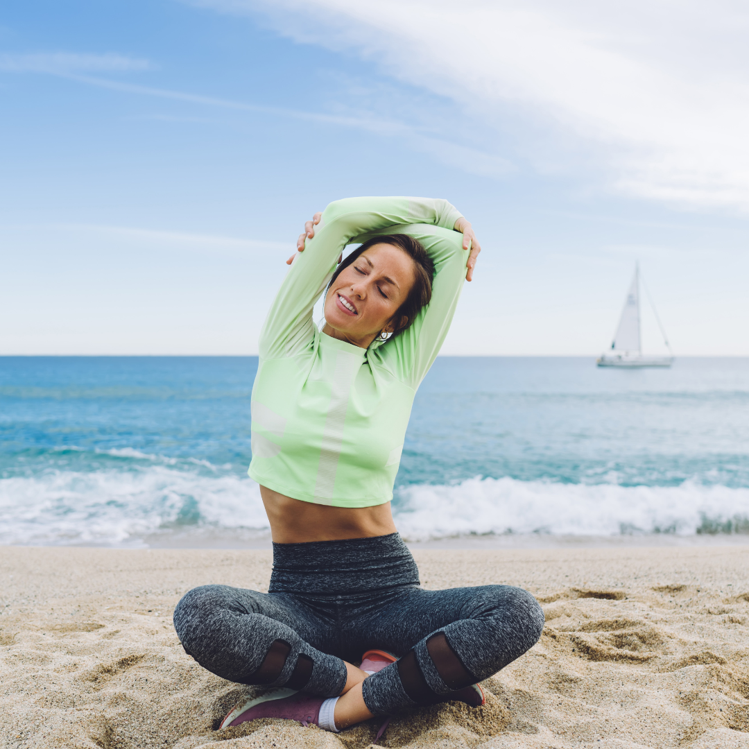 Woman Stretching on Beach